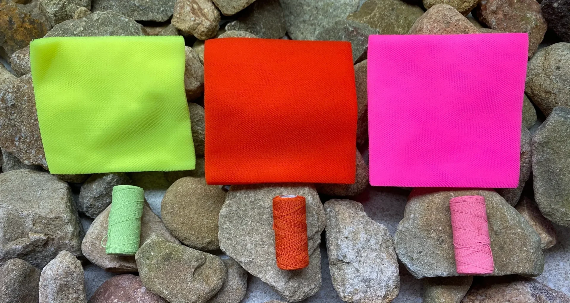 A group of post it notes sitting on rocks.