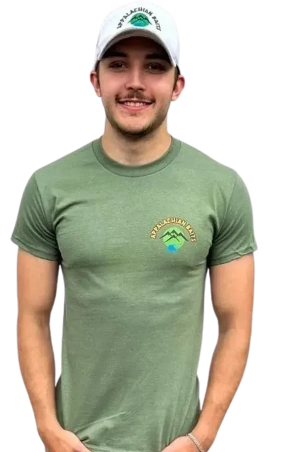 A man wearing a green shirt with a logo on the chest.