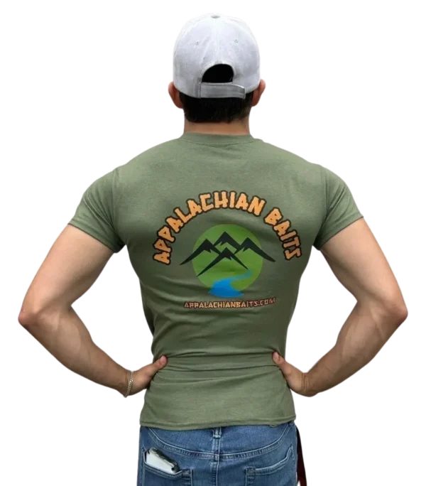 A man in green shirt and hat with mountains on back.