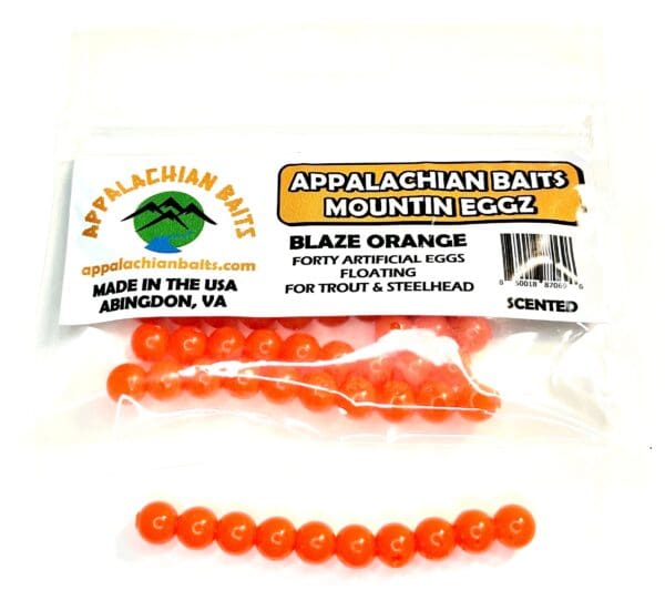 A package of orange beads and a string.