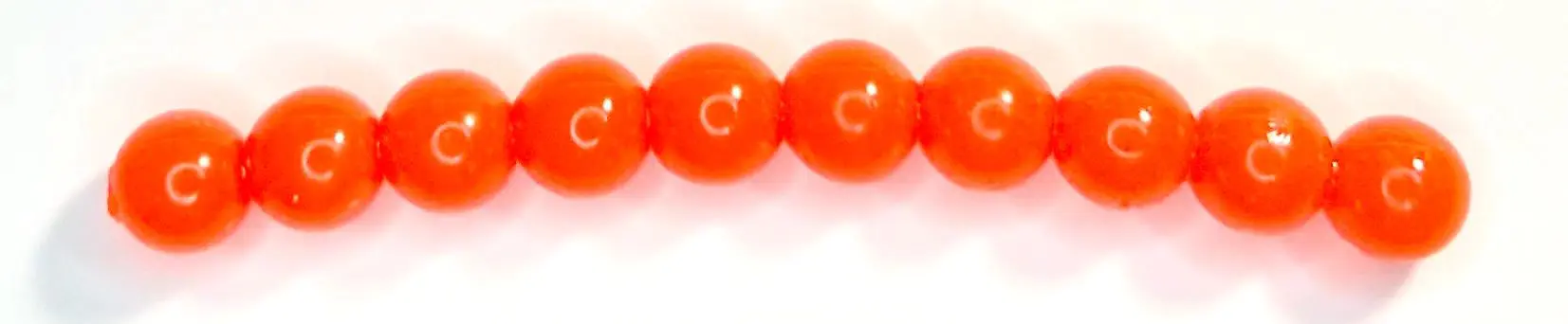 A row of orange beads sitting on top of each other.