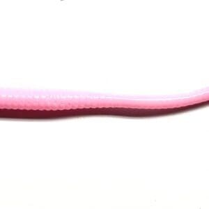 A pink plastic tube with a long handle.