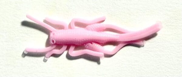 A pink plastic toy of an octopus.