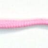A pink worm is on the white surface.
