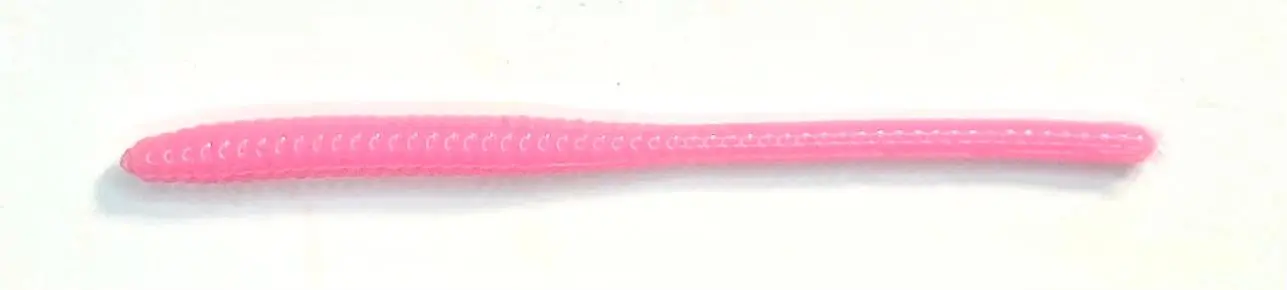 A pink toothbrush with a white stripe on it.