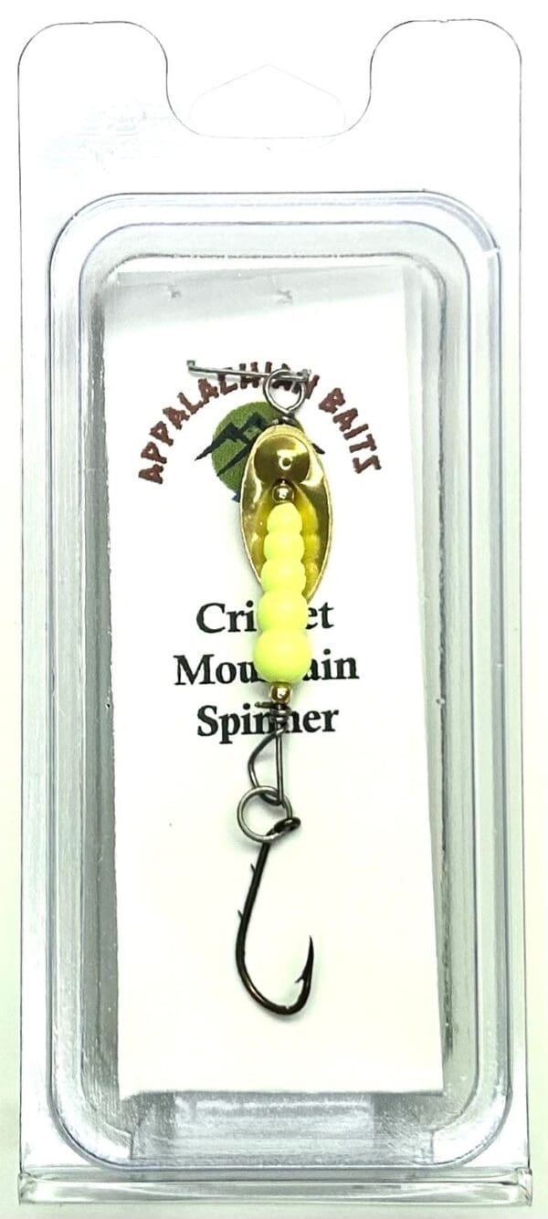 A yellow fishing lure hanging on the side of a card.