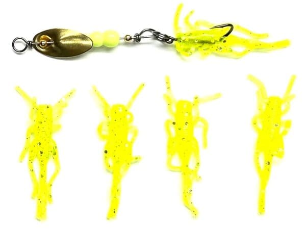 A yellow fishing lure with several different types of plastic.