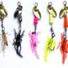 A group of different colored fishing lures hanging on a line.