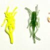 A group of plastic toy bugs sitting on top of a table.