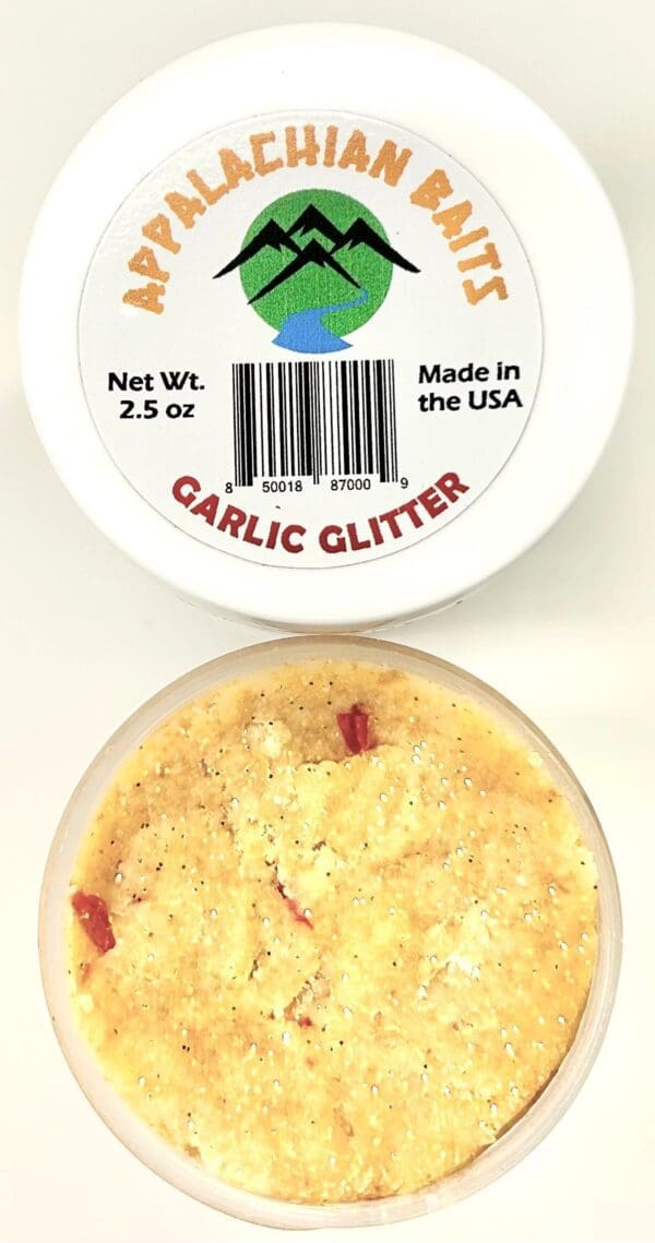 A container of garlic glitter next to another container.