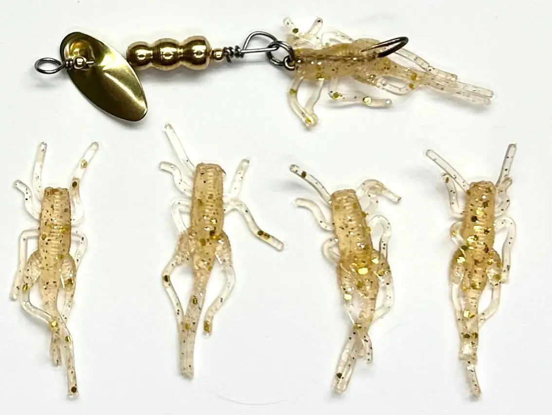 A group of small plastic shrimp with a fishing hook.