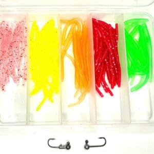 A plastic container filled with different colors of fishing baits.