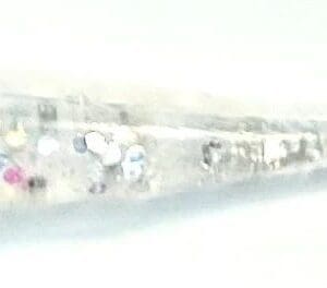 A blurry image of the side of a skateboard.