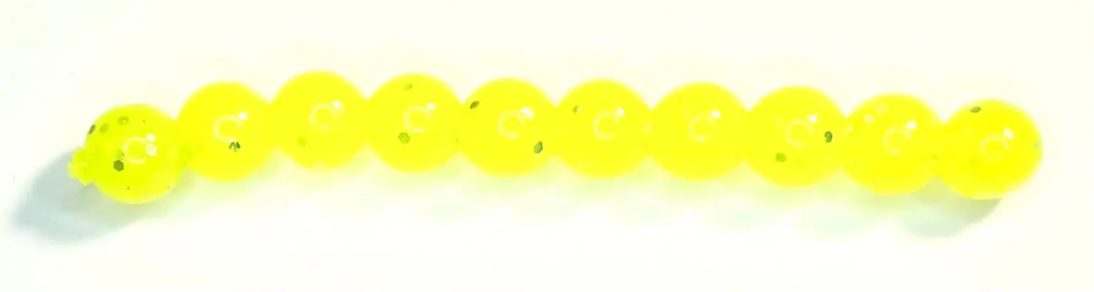 A row of yellow beads sitting on top of each other.