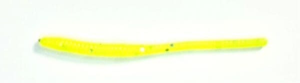 A yellow toothbrush with white dots on it.