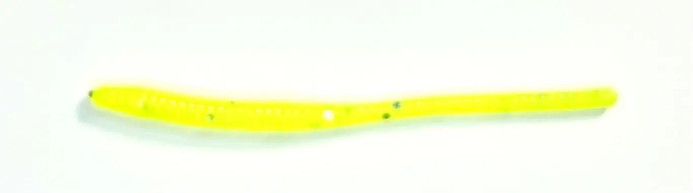 A yellow toothbrush with white dots on it.