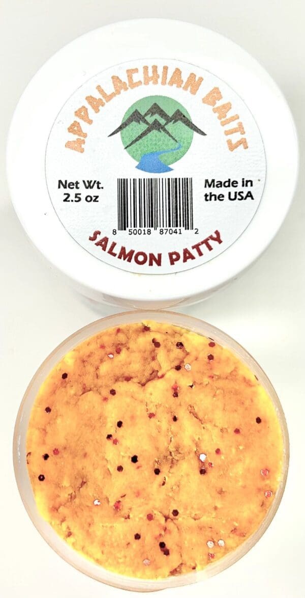 A container of salmon patty sitting next to another container.