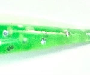 A close up of the side of a green pencil