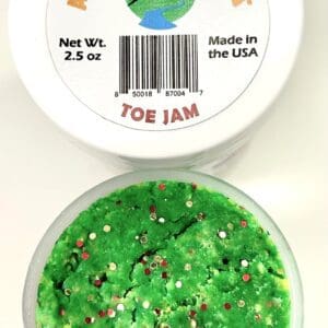 A container of green jelly with white and brown speckles.