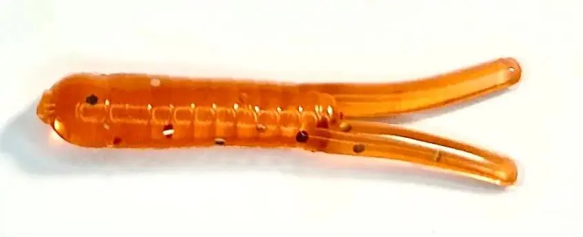 A close up of an orange plastic worm