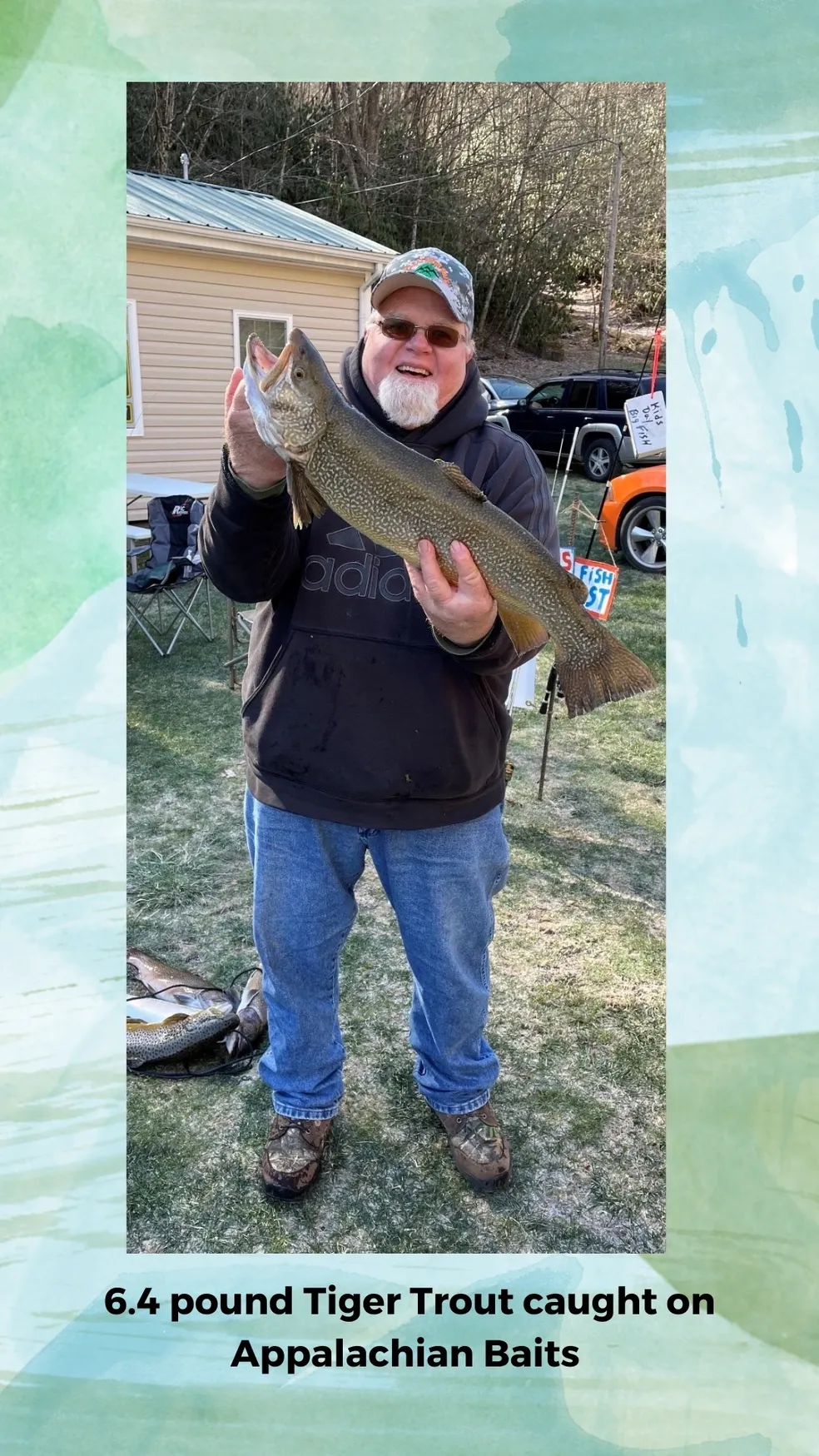 A man holding a fish in his hand.