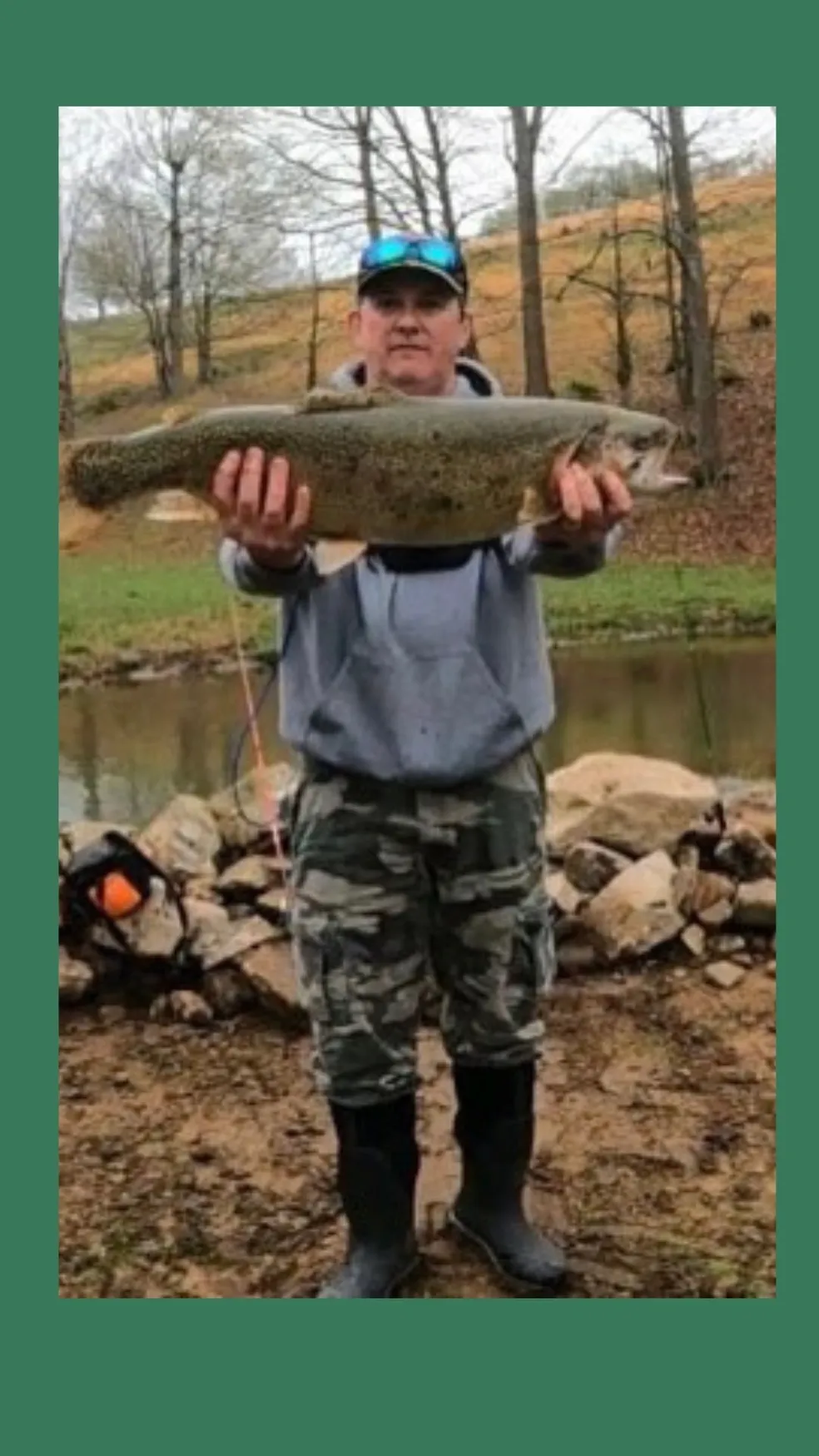 A man holding a fish in his hands.