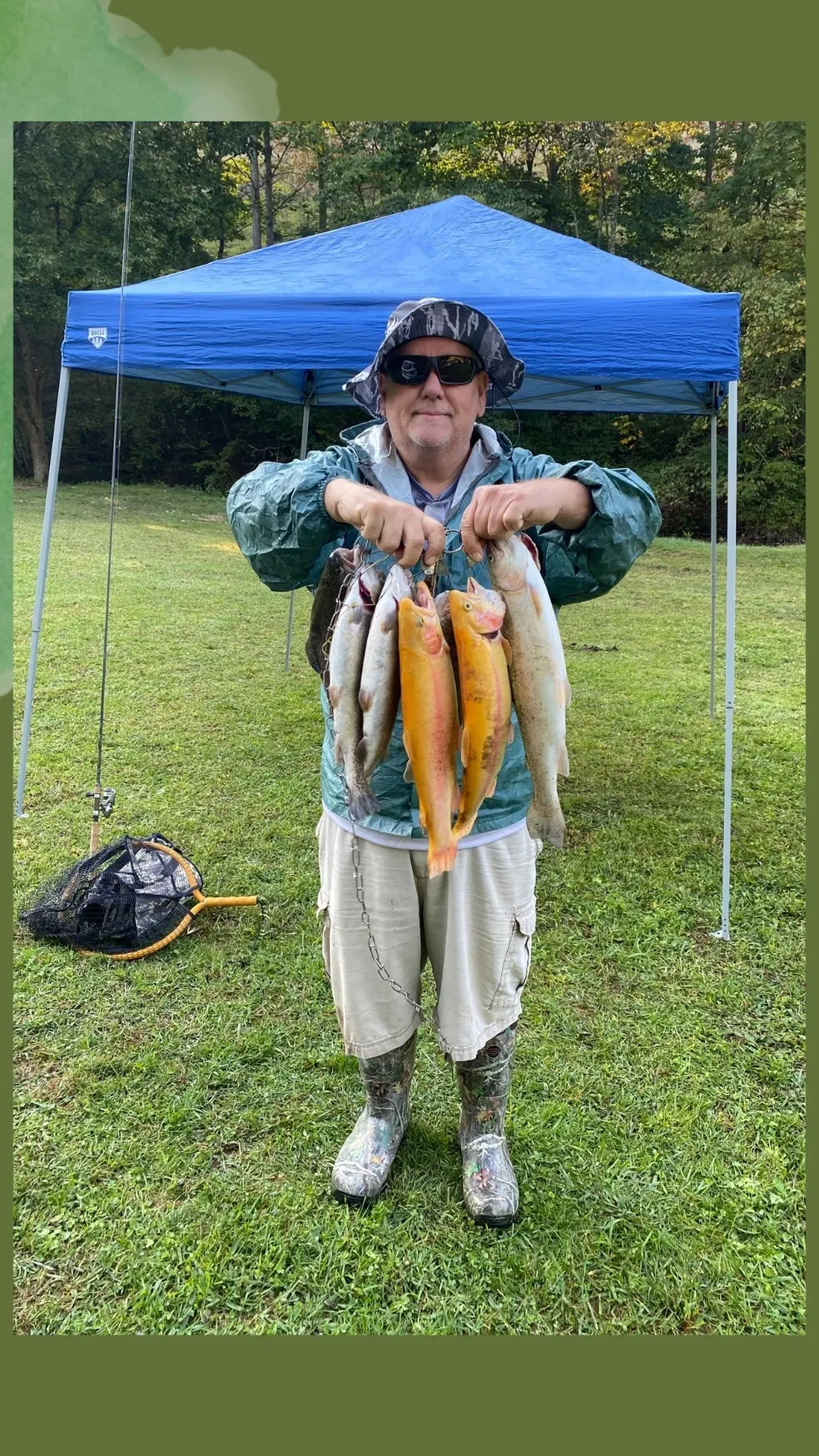 A man holding fish under an umbrella.