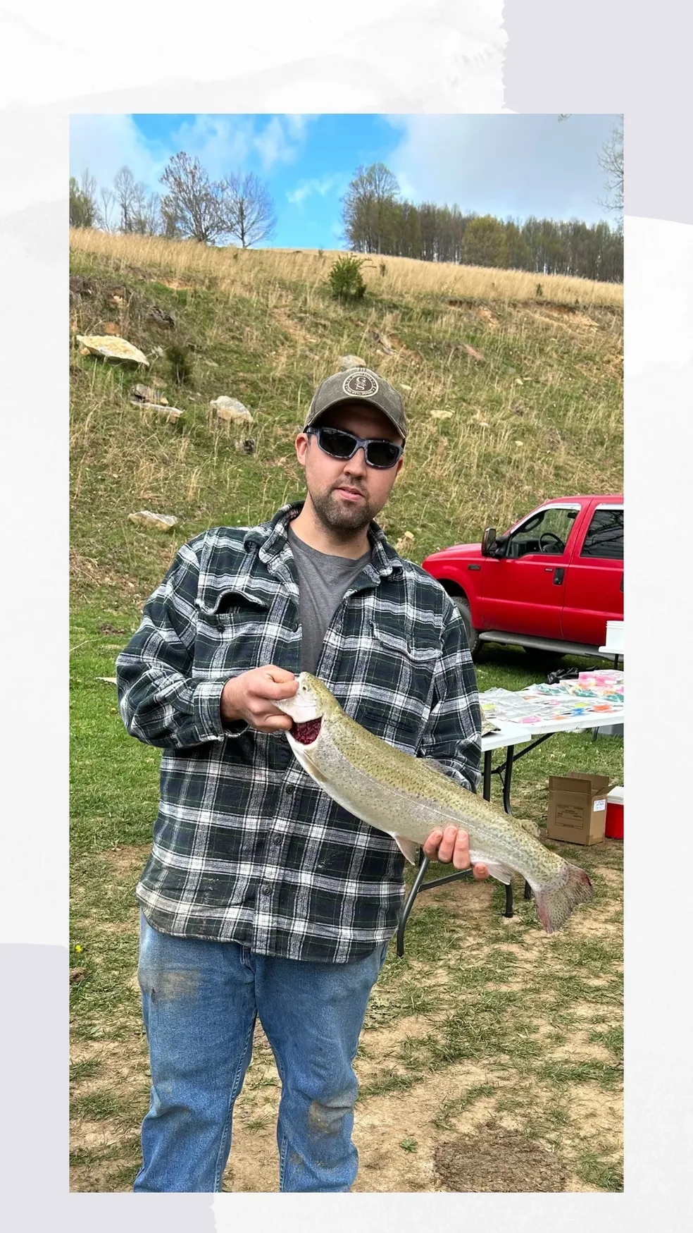 A man holding a fish in his hand.