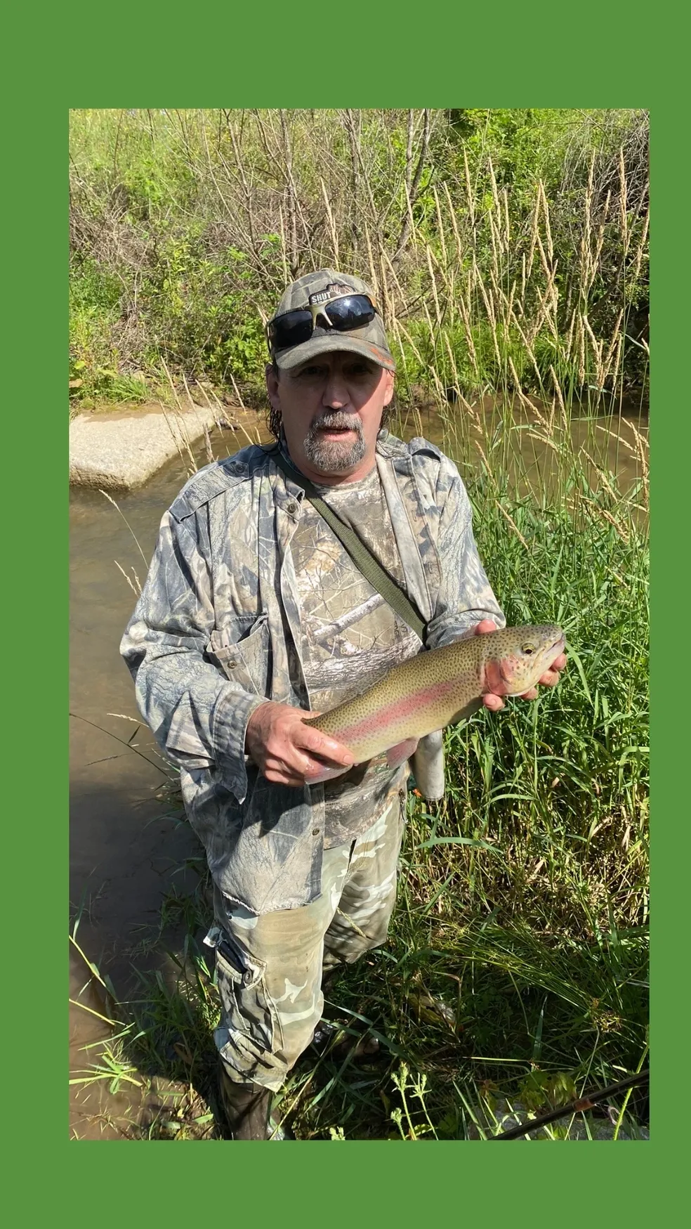 A man holding a fish in his hands.